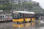 Postauto/PU ATM TI 310 512/PAG-ID: 10411 (Scania/Hess K320UB ''Bergbus'') am 13.4.2026 beim Bhf.