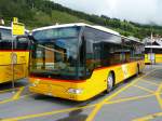 Postauto - Mercedes Citaro  GR 102341 bei den Haltestellen beim Bahnhof in Scuol Tarasp am 13.09.2010