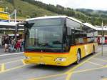 Postauto - Mercedes Citaro  GR 102393 bei den Haltestellen beim Bahnhof in Scuol Tarasp am 13.09.2010