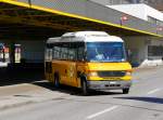 Postauto - Kleinbus Mercedes O 815  TI  151872 bei der ausfahrt bei den Bushaltestellen vor dem Bahnhof in Mendrisio am 10.03.2016