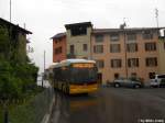 Postauto/PU Malcantone TI 182 443 (Scania/Hess Bergbus K270UB) am 1.5.2010 in Migleglia, Paese. Der Bergbus von Hess mit einer Lnge von nur 9.7m aber einer Leistung von bis zu 320PS ist ein guter Kompromiss um auch in steilen Gegenden Niederflurige Einstiege zu bieten.