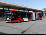 Chur Bus - MAN Lion`s City Hybrid  GR 155857 unterwegs bei den Bushaltestellen vor dem Bahnhof in Chur am 19.02.2021