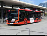 Chur Bus - MAN Lion`s City Hybrid  GR 97520 bei den Bushaltestellen vor dem Bhf. Chur am 03.10.2023