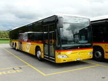 Postauto - Mercedes Citaro  JU 31178 abgestellt auf einem Parkplatz einer Garage etwas ausserhalb von Delemont am 08.09.2013