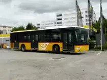 Postauto - Mercedes Citaro  JU 61305 abgestellt auf einem Parkplatz in Delemont am 08.09.2013