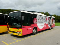 Postauto - Setra S 315 NF  JU  21773 abgestellt auf einem Parkplatz einer Garage etwas ausserhalb von Delemont am 08.09.2013