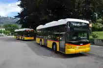 AutoPostale della Capriasca, Tesserete. 2 Scania/Hess K320UB (links TI 211'039, rechts TI 248'837) in Tesserete, Stazione. (26.6.2012)