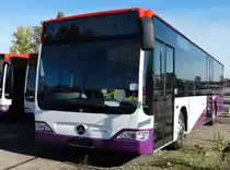 Mercedes Benz Citaro C1 Facelfit für Singapur am 18.10.14 in Mannheim bei Evo Bus durch den Zaun fotografiert auf einen öffentlichen Parkplatz