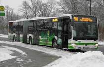 MB O 530 C2 GÜ, der PM-E 241 mit neuer Werbung des  PlusBus Hoher Fläming  Konzepts, am Bad Belziger Busbahnhof, 30.12.14
