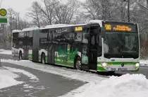 MB O 530 C2 GÜ, der PM-E 241 mit neuer Werbung des  PlusBus Hoher Fläming  Konzepts, am Bad Belziger Busbahnhof, 30.12.14