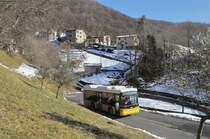 AutoPostale della Capriasca, Tesserete. Scania/Hess K320UB (TI 248'837) in Odogno, Bivio per Bettagno. Im Hintergrund steht Bettagno. (19.2.2015)
