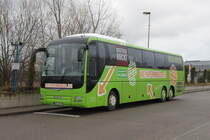 MAN Lion's Coach stand am 11.12.2015 mit Rostock rockt-Aufkelber in H�he Rostock Hauptbahnhof/S�d abgestellt