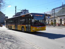 Postauto - MAN Lion`s City GR 106166 unterwegs vor dem Bahnhof in Chur am 26.03.2016