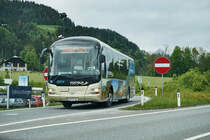 Ein MAN Lion's Regio von POSTBUS mit einer Werbebeklebung für das Großarltal, am 17.5.2016  unterwegs bei St. Johann im Pongau.