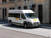 Postauto / PubliCar - Fiat  JU 69131 vor dem Bahnhof in Delemont am 09.07.2016