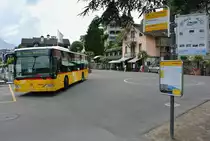Postauto Citaro I auf der Linie 64 bei der Schiffstation in Spiez, 21.07.2016.