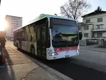 Citaro Nr. 24 mit Vollwerbung für den Libero Tarifverbund  am 10.3.17 beim warten auf die Abfahrt beim Bhf Grenchen Süd.