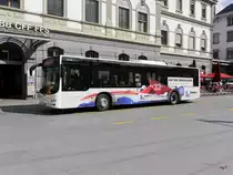 Postauto / Ortsbus Brig - MAN Lion`s City VS 449117 vor dem Bahnhof in Brig am 01.04.2017