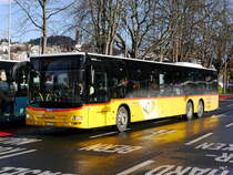 Postauto - MAN Lion`s City  LU  15510 unterwegs vor dem Bahnhof in Luzern am 09.12.2017