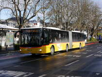 Postauto - MAN Lion`s City  LU 15559 unterwegs vor dem Bahnhof in Luzern am 09.12.2017