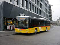 Postauto - MAN Lion`s City  BL  212446 bei den Bushaltestellen vor den Bahnhof in Liestal am 23.12.2017