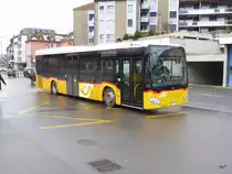 Postauto - Mercedes Citaro  VD  2704 bei den Bushaltestellen beim Bahnhof in Payerne am 10.02.2018