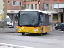 Postauto - Mercedes Citaro VD 475383 bei der zufahrt zu den Bushaltestellen beim Bahnhof in Payerne am 10.02.2018