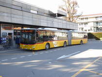 Postauto - MAN Lion`s City  BE  32923 in Aarberg vor der Post am 15.03.2018