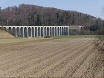 Postauto - MAN Lion`s City unterwegs bei Viadukt in Gümmenen am 24.03.2018