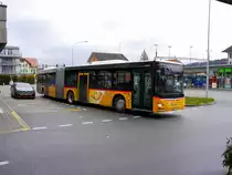 Postauto - MAN Lion`s City  BE  637670 beim verlassen der Haltestelle in Aarberg am 31.03.2018