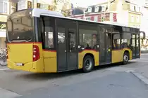 Heck des PostAuto MB C2 K '10260' vom Ortsbus Delemont nach der Abfahrt beim Bahnhof Delemont.