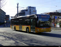 Postauto - MAN Lion`s City GR 95435 unterwegs bei den Bushaltestellen vor dem Bahnhof in Chur am 19.02.2021