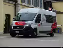 Postauto - Fiat Ducato  JU  47045 vor dem Bahnhof in Delemont am 08.04.2023