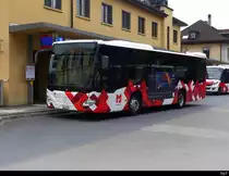 Postauto - Mercedes Citaro  JU 32742 vor dem Bahnhof in Delémont am 08.04.2023