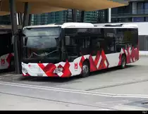 Postauto - Mercedes Citaro JU 52436 vor dem Bahnhof in Delémont am 08.04.2023