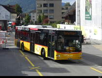 Postauto - MAN Lion`s City  OW 10001 vor dem Bhf. Stans am 21.09.2023