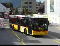 Postauto - MAN Lion`s City  OW 10001 vor dem Bhf. Stans am 21.09.2023