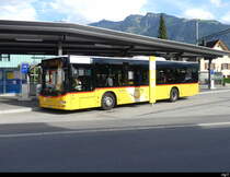 Postauto -MAN Lion`s City  OW 16211 vor dem Bhf. Sarnen am 21.09.2023