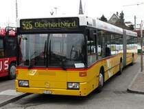 Postauto - Mercedes O 405 GN  ZH 780687 unterwegs auf der Linie 525 in B�lach am 20.02.2009