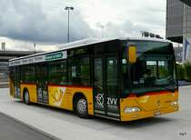 Postauto - Mercedes Citaro ZH 401766 unterwegs auf der Linie 510 bei den Bushaltestellen vor dem Flughafen Z�rich in Kloten am 11.10.2009