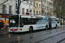 SWN 235 (NE ZS 235) mit Werbung f�r die Rathaus Arkaden Kaarst.
Aufgenommen auf der Schwannstr. in Neuss mit der Linie 852 nach Norf.
28.11.2009
