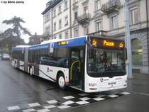 Postauto/BDWM (PU Wicki) AG 438 038 (MAN Lion's City GL) am 1.12.09 in der Ulmbergstrasse, vis-a-vis des Bhf. Zrich Enge. Die Postautos der Linie 444 (Bremgarten - (etlibergtunnel) - Zrich Enge) haben beim Bhf. Enge eine lngere Pause. Die sie aus Platzgrnden in der Ulmbergstrasse verbringen. Da die Wicki-Postautos nicht am ZVV-Leitsystem angeschlossen sind, erscheint auf der LED-Anzeige, wenn Pause steht jeweils auch noch 2 Kaffeetassen, was im ZVV leider nicht der Fall ist.