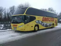 Neoplan Starliner Wg.475 von Graf Reisen Herne macht werbung f�r das 80 J�hrige Jubil�um. Abgestellt in H�he Centrum Burg auf Fehmarn.(23.12.09)