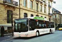 TN Neuchtel Nr. 299/NE 74'299 MAN am 5. Dezember 2009 Neuchtel, Place Pury (mit Vollwerbung fr  la maladiere centre )