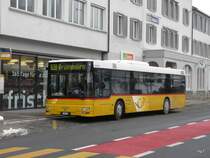 Postauto - MAN  SG 284107 unterwegs auf der Linie 182 bei der Bushaltestelle vor dem Bahnhof Herisau am 16.01.2010