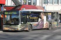 MAN  Flughafen-Zubringer-Bus  - Bonn - Flughafen Kln/Bonn - am Hbf Bonn, 26.12.2009. Mit einer Werbeaufklebung, die echten  Tarnkarakter  hat !!