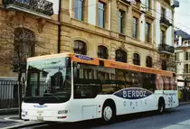 TN Neuch�tel Nr. 207/NE 114'207 MAN am 22. M�rz 2010 Neuch�tel, Place Pury (mit Vollwerbung f�r  BERDOZ OPTIC )