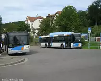 Das Foto zeigt einen Solaris Urbino sowie ein Bus der Marke MAN. Das Foto wurde am 06.09.2010 in Saarbr�cken Brebach gemacht.