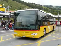 Postauto - Mercedes Citaro  GR 102393 bei den Haltestellen beim Bahnhof in Scuol Tarasp am 13.09.2010