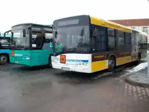 Ein VOLVO links und ein SOLARIS am 10.Januar 2011 am Busbahnhof in Bergen/R�gen.
